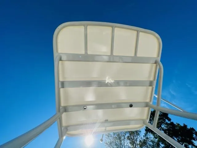 Slide: The Image of Boston Whaler 360 Outrage 2023 boat canopy against clear blue sky. - 47