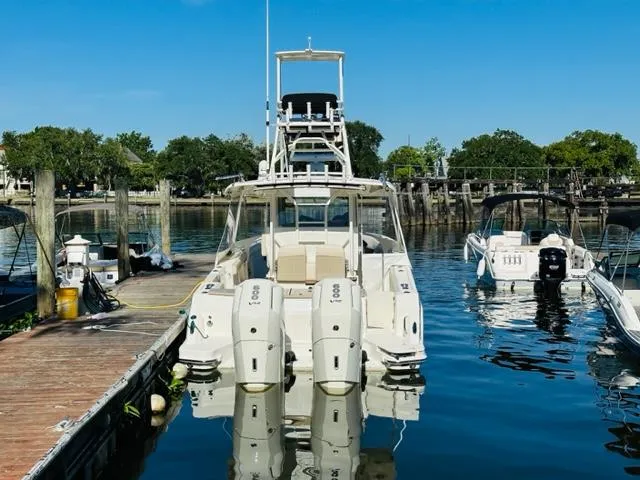 Slide: The Image of 2023 Boston Whaler 360 Outrage docked at a marina. - 6