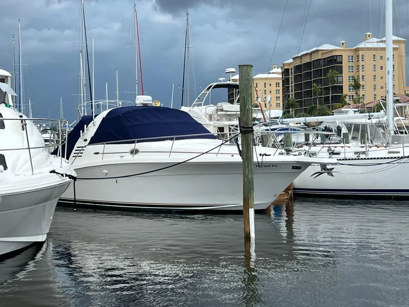 Slide: The Image of 2001 Sea Ray 340 Amberjack docked at marina with stormy sky. - 1
