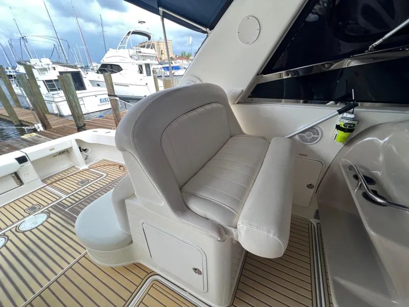 Slide: The Image of Interior seating of a 2001 Sea Ray 340 Amberjack at a marina. - 13