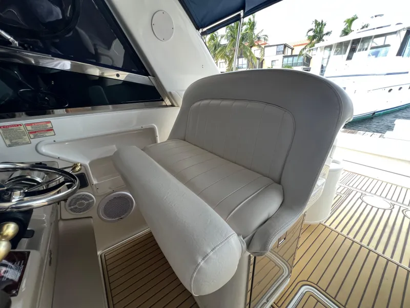 Slide: The Image of Captain's seat and helm of a 2001 Sea Ray 340 Amberjack boat. - 17