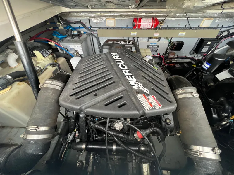 Slide: The Image of Engine compartment of a 2001 Sea Ray 340 Amberjack with a Mercury engine. - 26