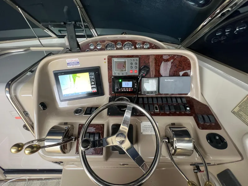 Slide: The Image of 2001 Sea Ray 340 Amberjack helm with navigation and control systems. - 7