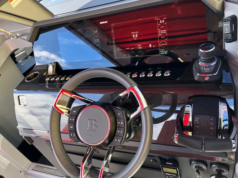 Slide: The Image of 2022 BRABUS Shadow 900 ST dashboard with advanced controls and carbon fiber finish. - 10