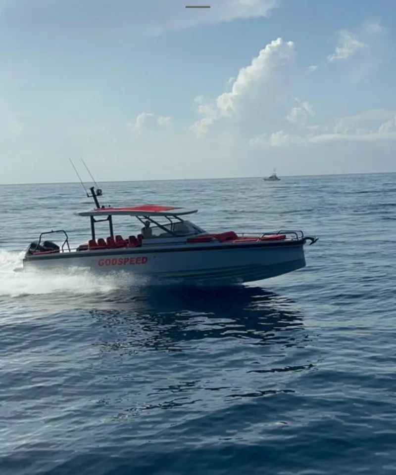 Slide: The Image of 2022 BRABUS Shadow 900 ST speedboat named GODSPEED cruising on open water. - 12