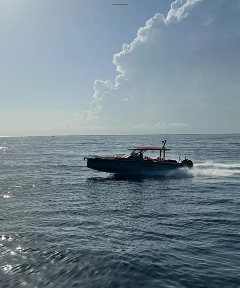 Slide: The Image of 2022 BRABUS Shadow 900 ST speedboat cruising on open water. - 13