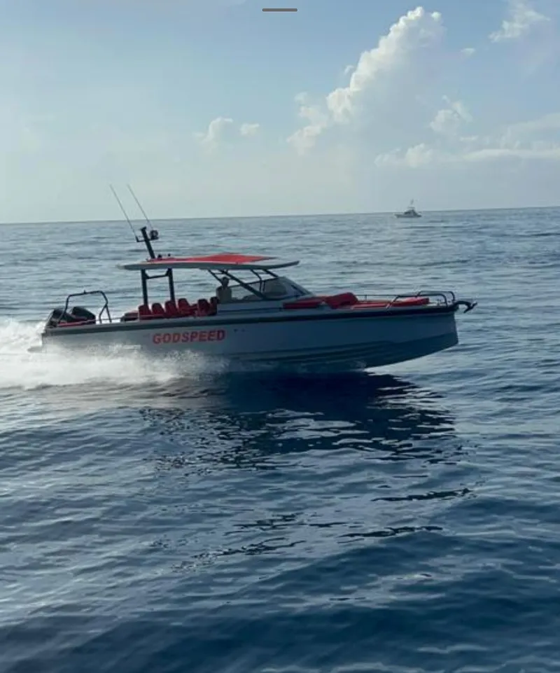 Slide: The Image of 2022 BRABUS Shadow 900 ST speedboat cruising on open water. - 14