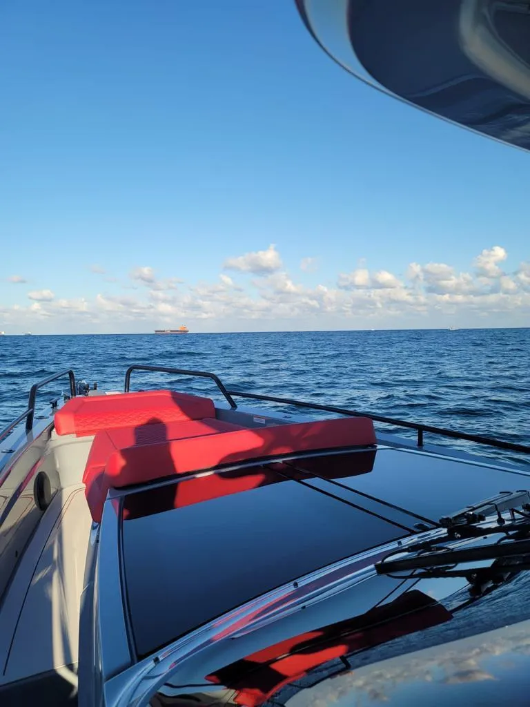 Slide: The Image of 2022 BRABUS Shadow 900 ST yacht cruising on open water. - 2