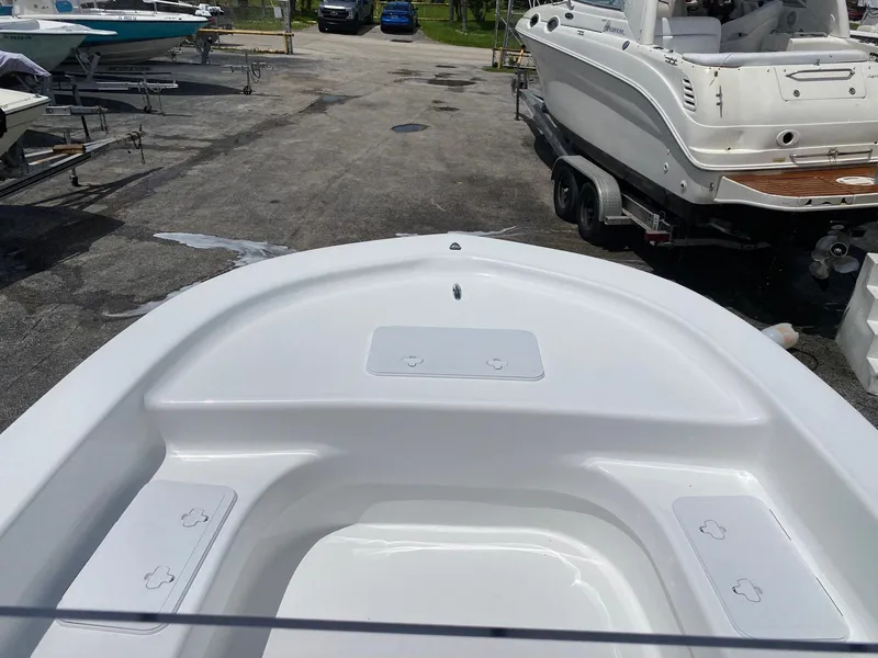 Slide: The Image of 2024 Savannah SS19 boat bow view at a marina. - 10