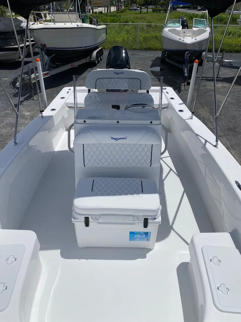Slide: The Image of 2024 Savannah SS19 boat interior with seating and storage compartments. - 11