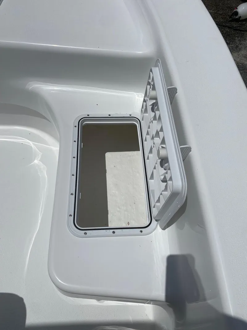 Slide: The Image of 2024 Savannah SS19 boat storage compartment with open hatch. - 14