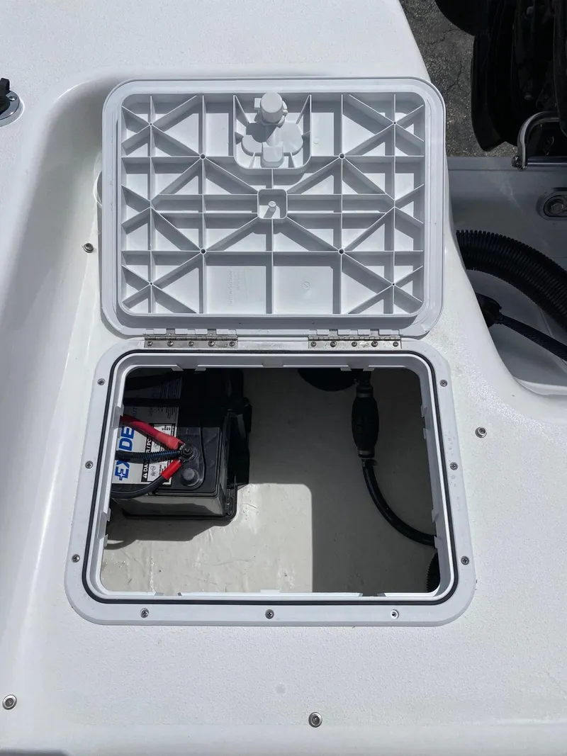 Slide: The Image of 2024 Savannah SS19 boat battery compartment with open hatch. - 20