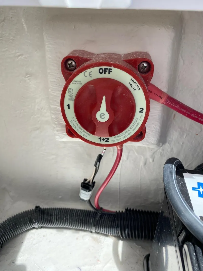 Slide: The Image of Red battery selector switch on a 2024 Savannah SS19 boat. - 21