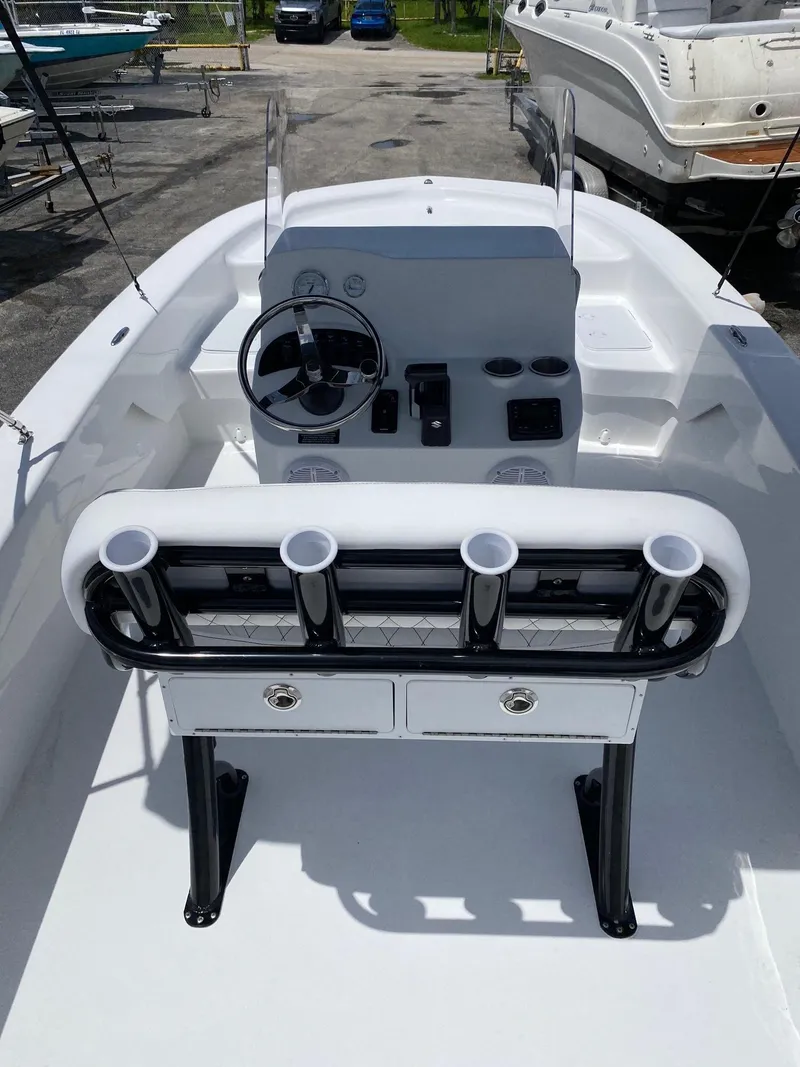 Slide: The Image of 2024 Savannah SS19 boat interior with steering console and rod holders. - 4