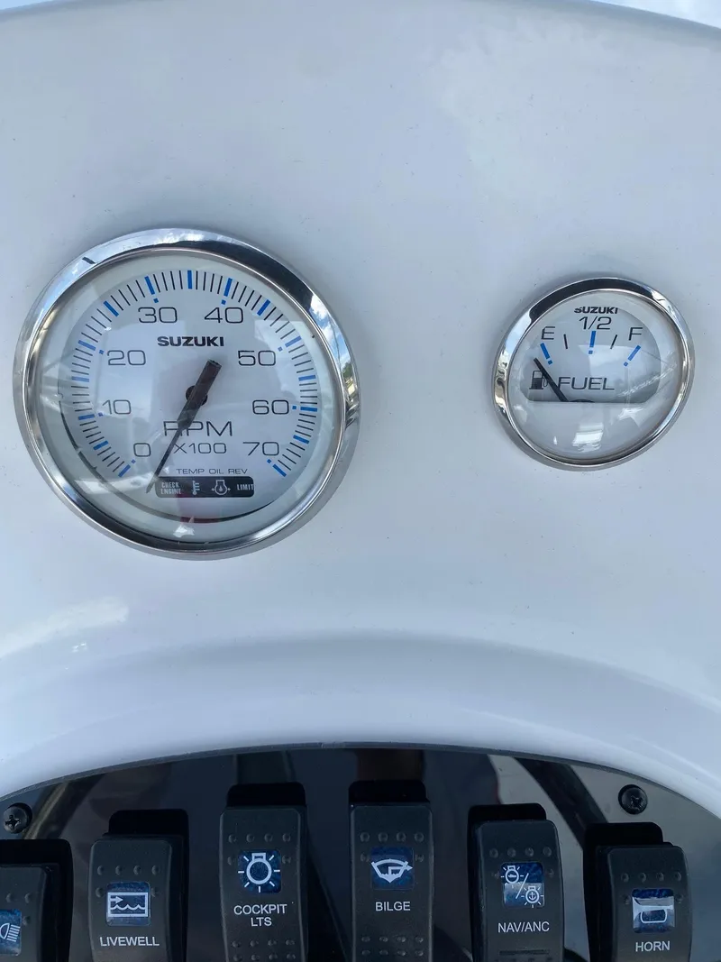Slide: The Image of 2024 Savannah SS19 boat dashboard with Suzuki RPM and fuel gauges. - 6