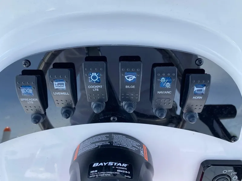 Slide: The Image of Control panel of a 2024 Savannah SS19 boat with various switches. - 7