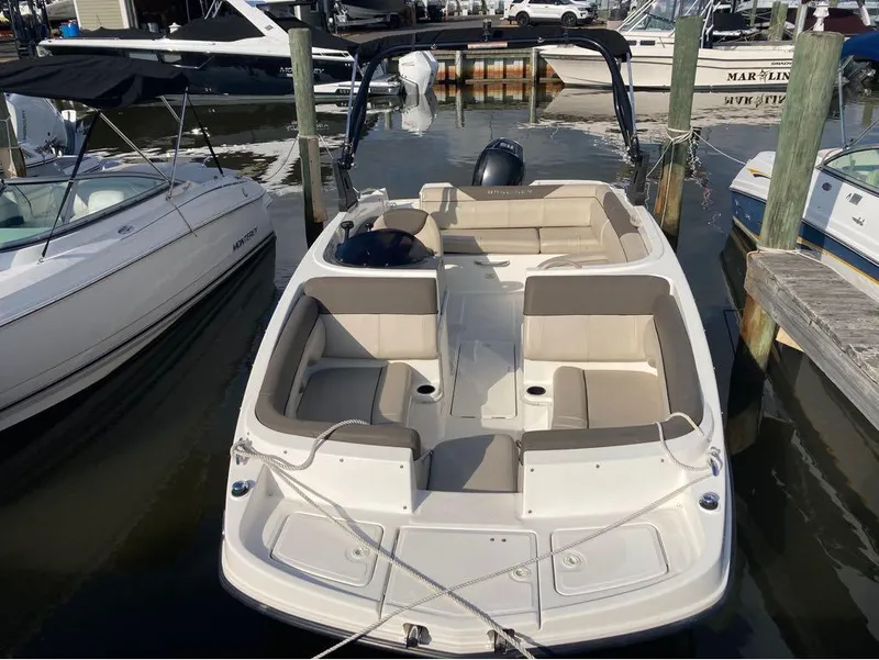 Slide: The Image of 2017 Bayliner 190 boat docked at marina with beige seating. - 3