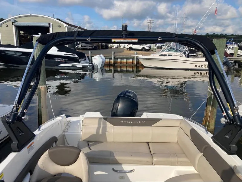 Slide: The Image of 2017 Bayliner 190 boat docked at a marina with other boats in the background. - 7