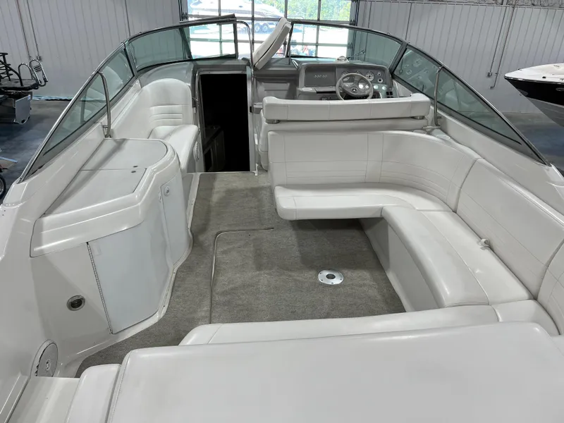 Slide: The Image of 1999 Formula 330 SS Sun Sport boat interior with white seating and helm. - 5