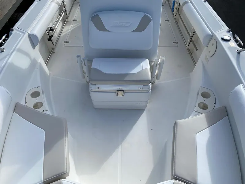 Slide: The Image of 2004 Boston Whaler 210 Outrage boat interior with seating and storage. - 7