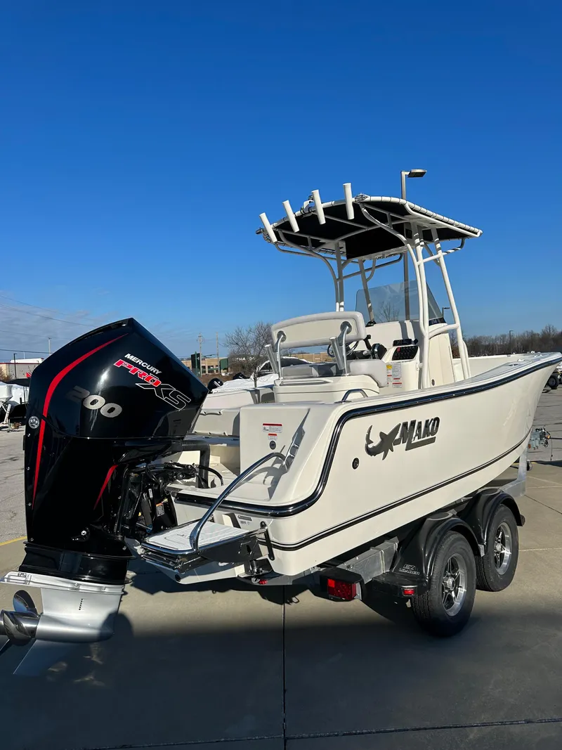 Slide: The Image of 2024 Mako 214 CC boat on trailer with powerful outboard motor. - 3