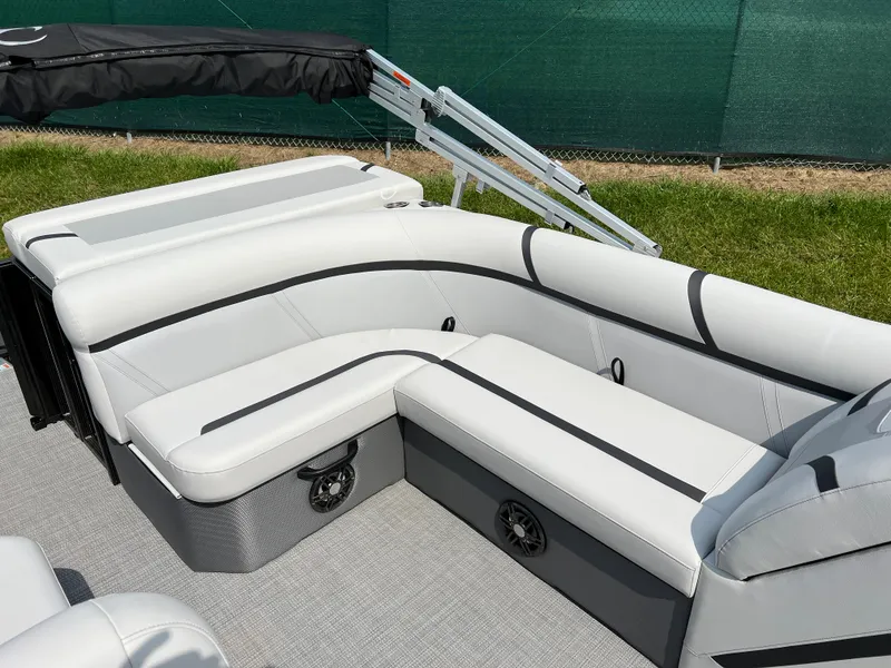 Slide: The Image of 2024 Crest Classic LX 220 pontoon boat with white and gray seating. - 10
