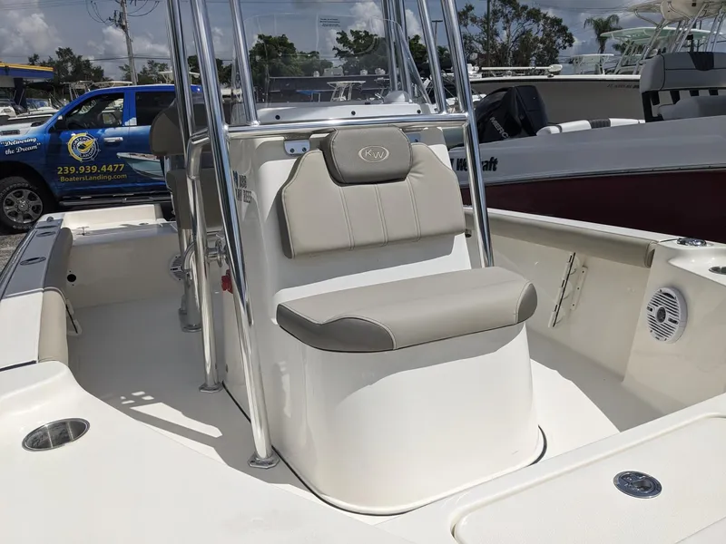 Slide: The Image of 2024 Key West 188 Bay Reef boat interior with seating and console. - 10