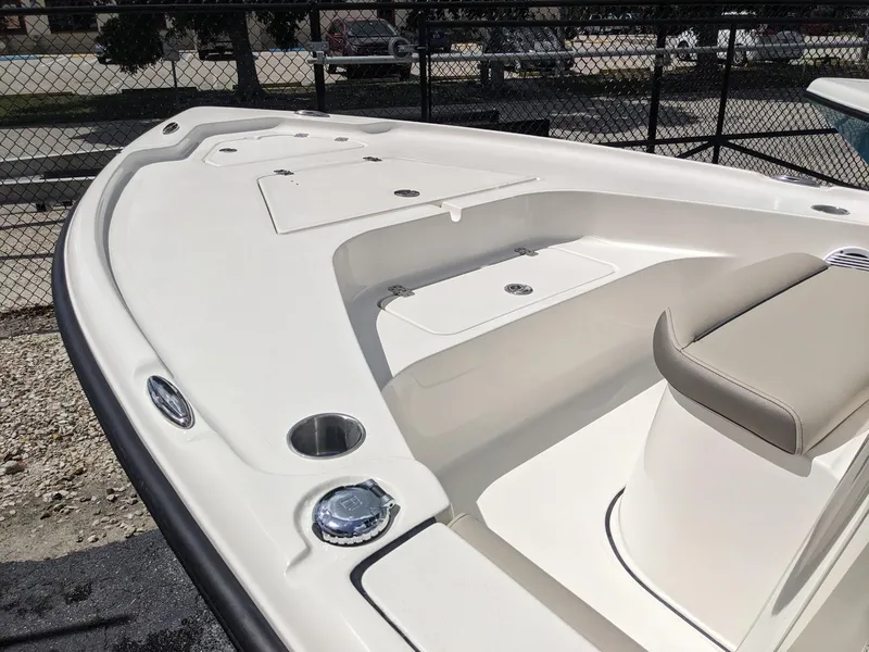 Slide: The Image of 2024 Key West 188 Bay Reef boat interior, front seating and storage compartments. - 11