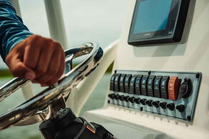 Slide: The Image of Close-up of 2024 Key West 188 Bay Reef boat console and steering wheel. - 23
