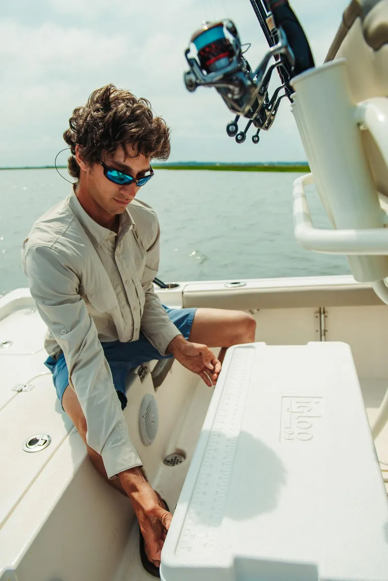 Slide: The Image of Man fishing on a 2024 Key West 188 Bay Reef boat. - 24