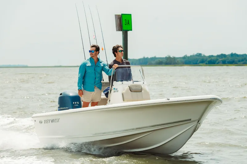 Slide: The Image of 2024 Key West 188 Bay Reef boat cruising with two people on board. - 30