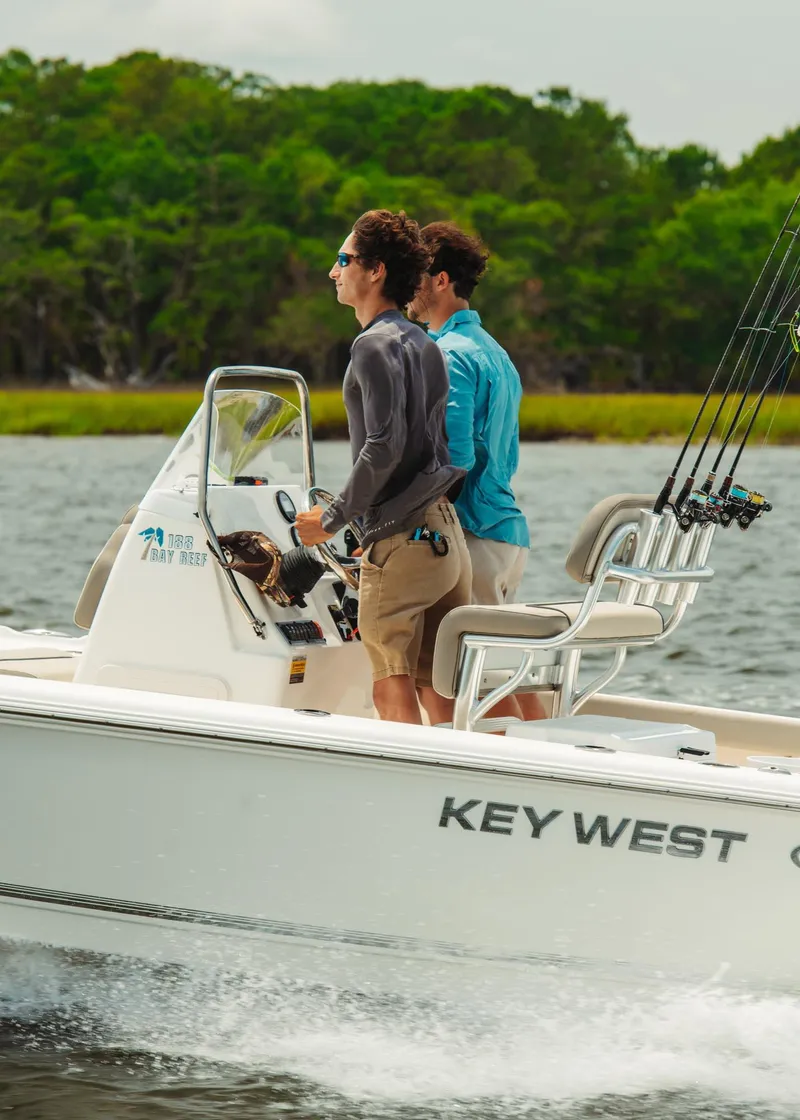 Slide: The Image of 2024 Key West 188 Bay Reef boat on water with two people. - 31