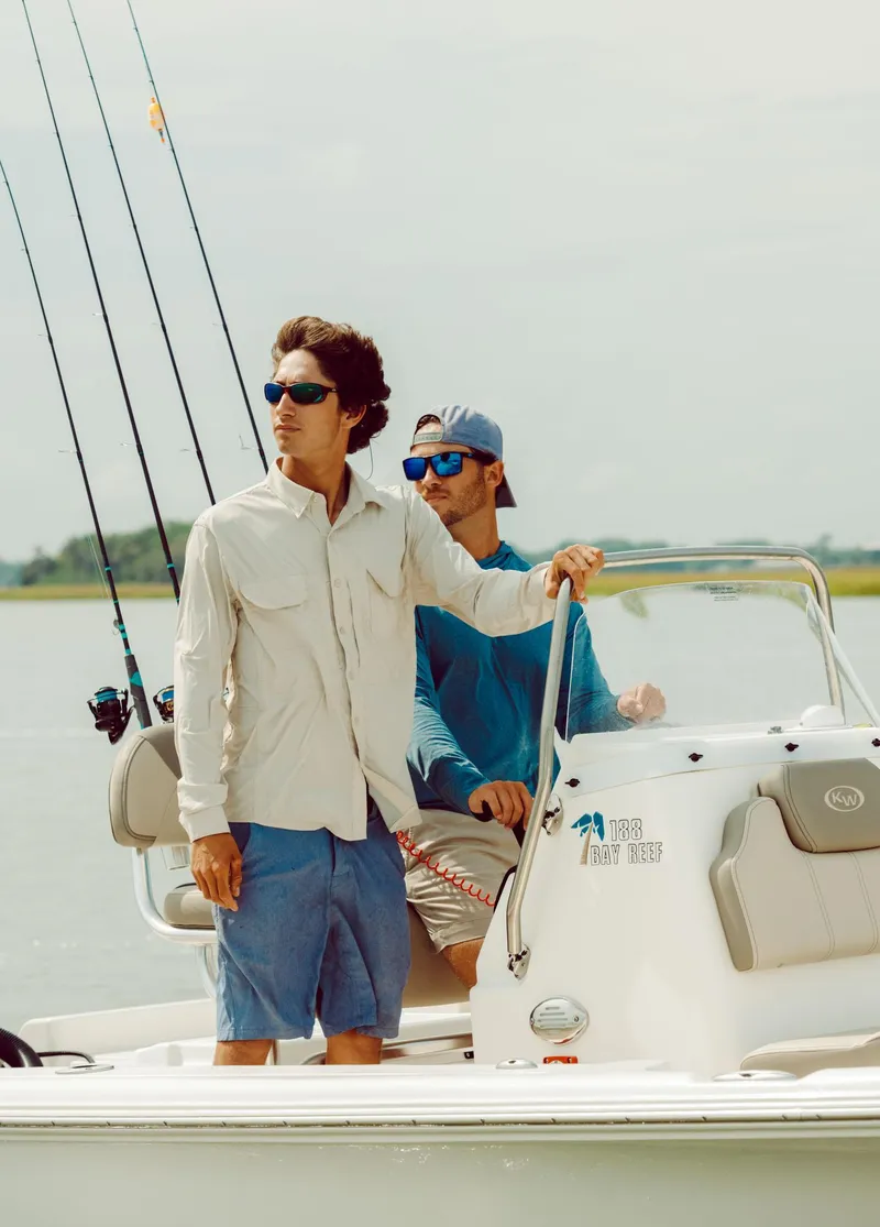 Slide: The Image of Two men fishing on a 2024 Key West 188 Bay Reef boat. - 35