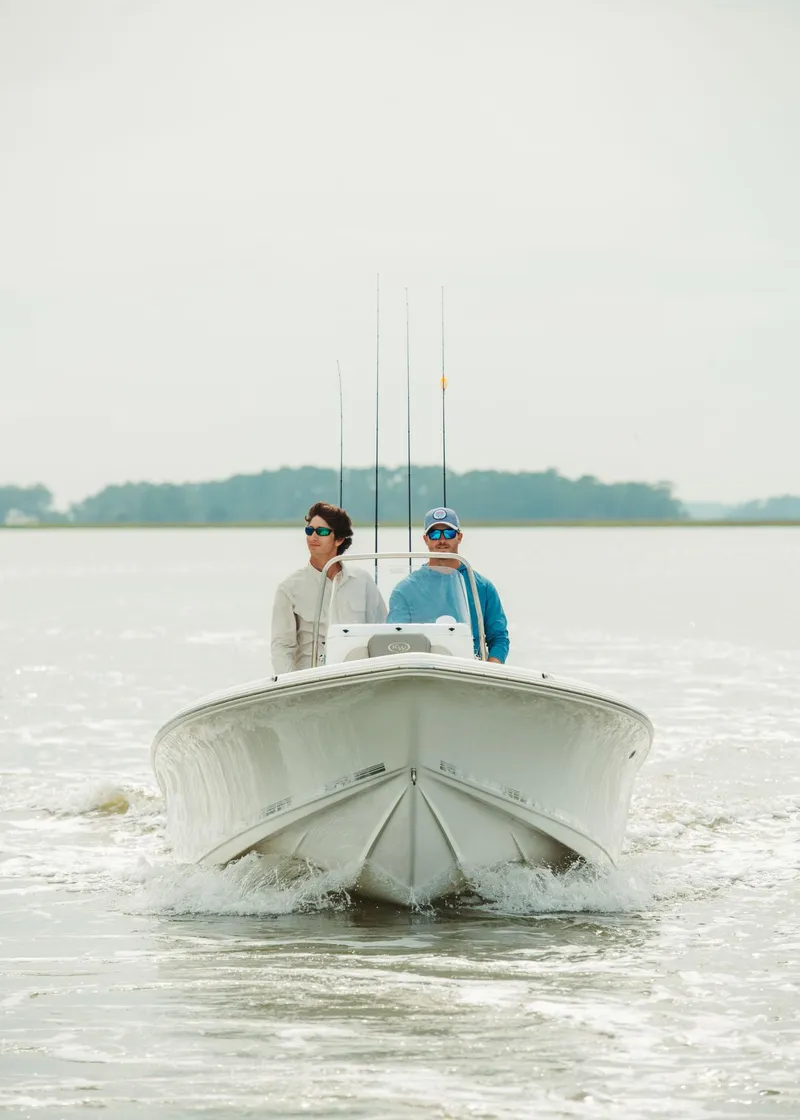 Slide: The Image of 2024 Key West 188 Bay Reef boat on water with two people onboard. - 36