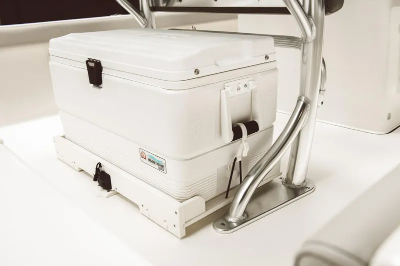 Slide: The Image of White cooler on 2024 Key West 188 Bay Reef boat, secured under metal frame. - 40