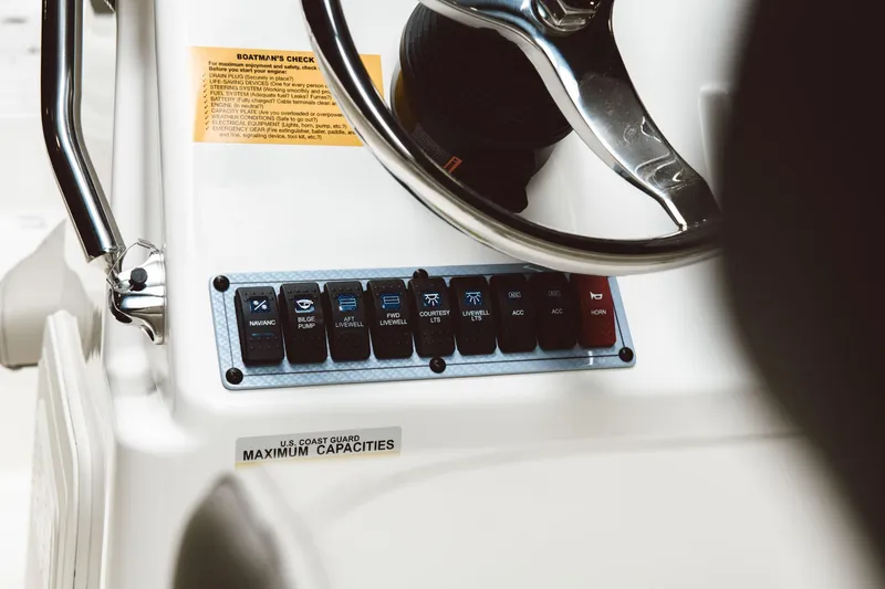 Slide: The Image of Close-up of the 2024 Key West 188 Bay Reef boat control panel and steering wheel. - 47