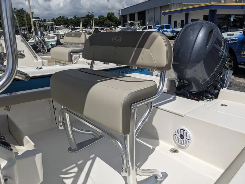 Slide: The Image of 2024 Key West 188 Bay Reef boat with seating and outboard motor. - 8
