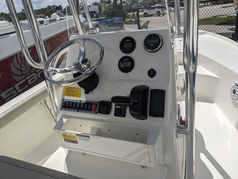 Slide: The Image of 2024 Key West 188 Bay Reef boat console with steering wheel and control panel. - 9