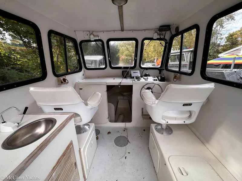 Slide: The Image of Interior of 2002 Eastern Lobsterman 22 boat with seating and control panel. - 9