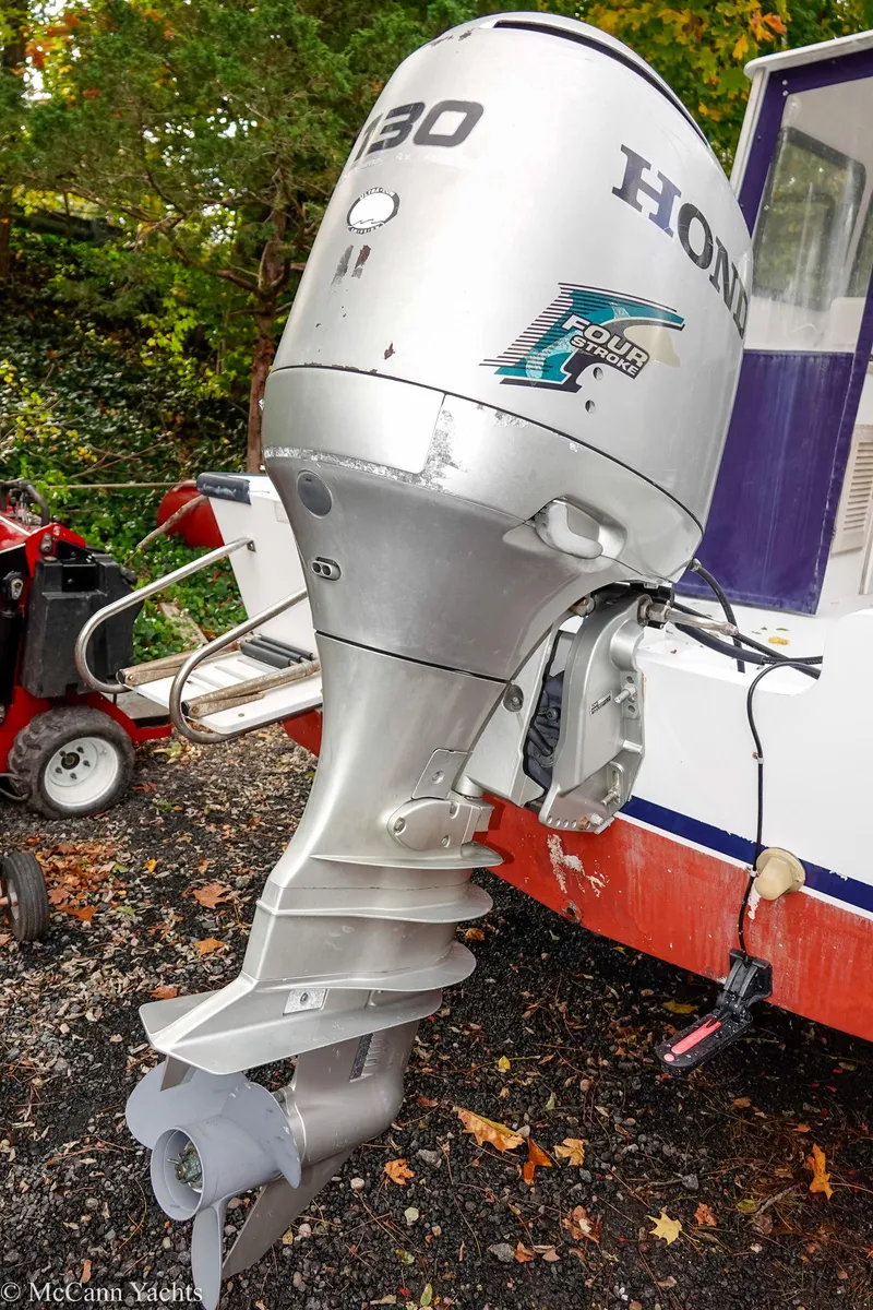 Slide: The Image of Outboard motor on 2002 Eastern Lobsterman 22 boat, featuring Honda 130 horsepower engine. - 20