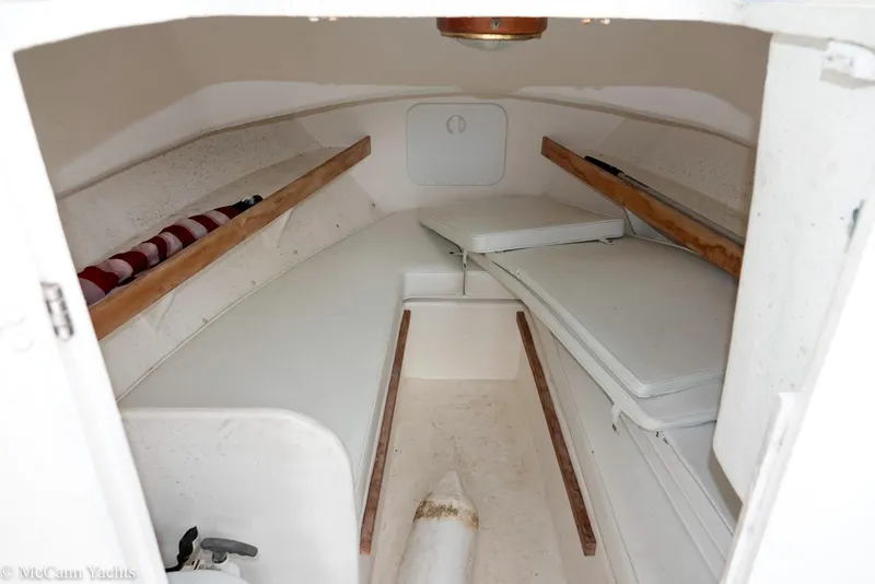 Slide: The Image of 2002 Eastern Lobsterman 22 cabin interior with wooden accents and storage compartments. - 35