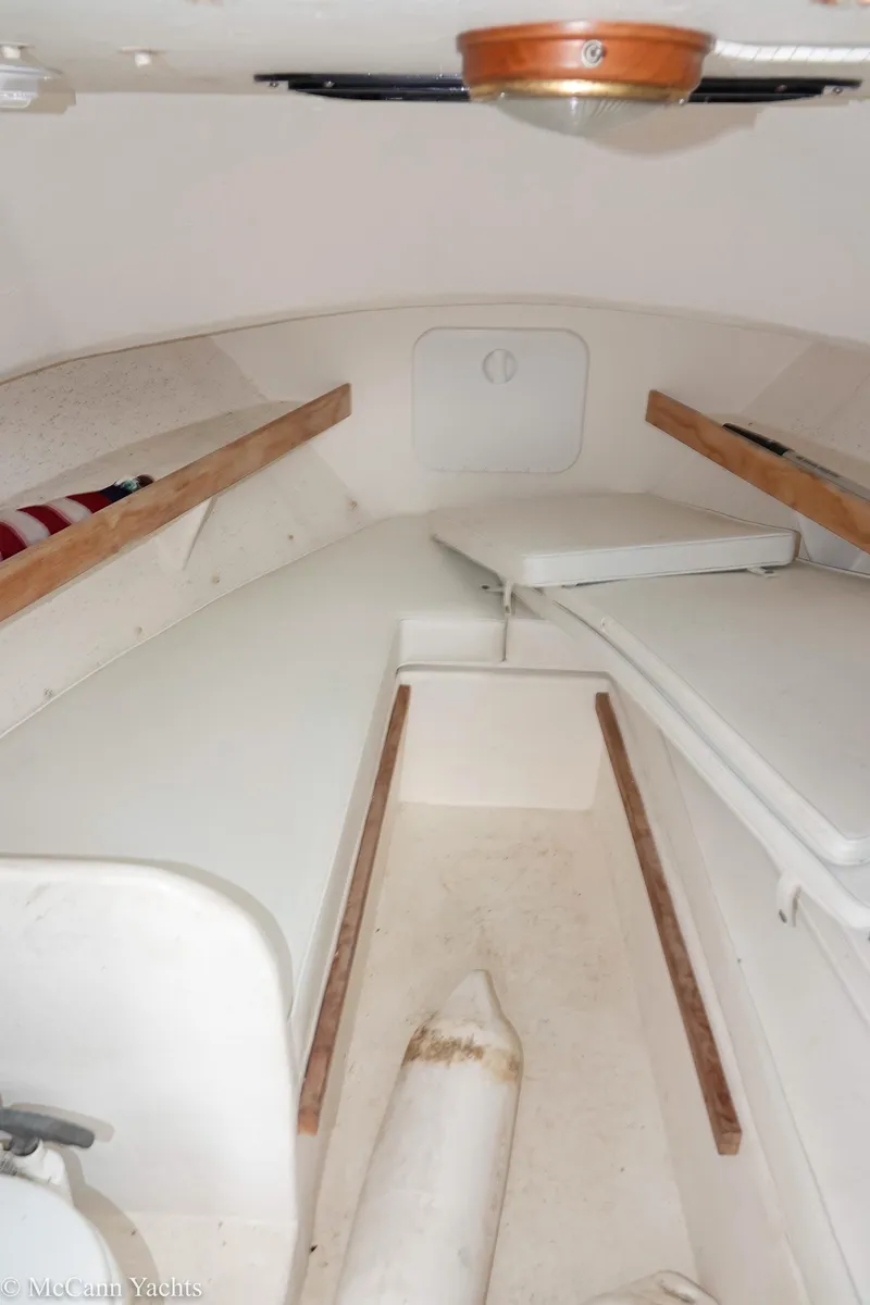 Slide: The Image of 2002 Eastern Lobsterman 22 cabin interior with white seating and wooden accents. - 36