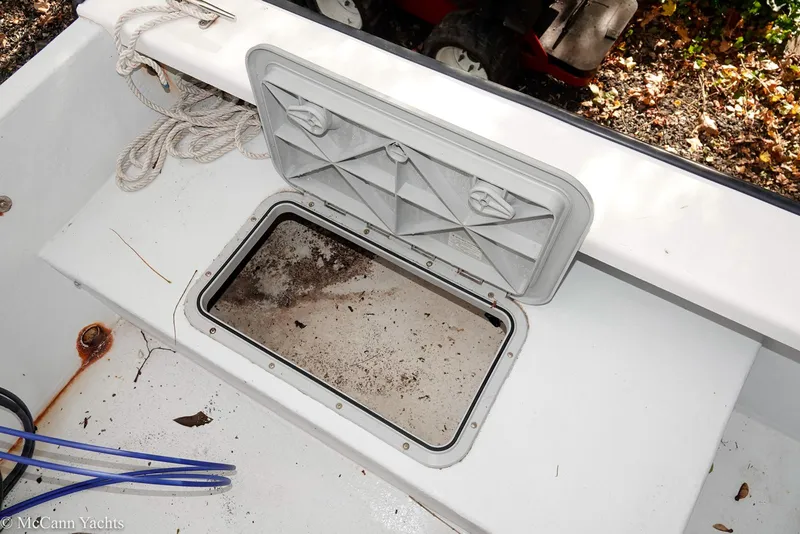 Slide: The Image of Open storage compartment on 2002 Eastern Lobsterman 22 boat deck. - 37