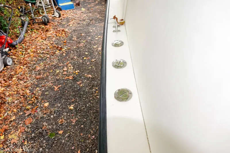 Slide: The Image of 2002 Eastern Lobsterman 22 boat detail with autumn leaves and equipment in the background. - 41