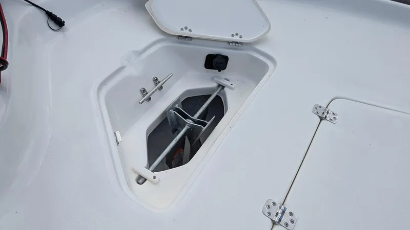 Slide: The Image of 2024 Key West 230 Bay Reef anchor storage compartment. - 15