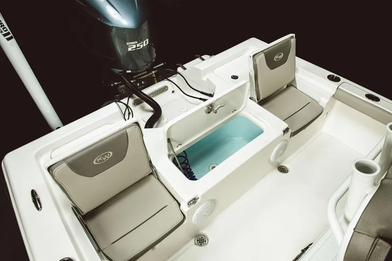 Slide: The Image of 2024 Key West 230 Bay Reef boat interior with seating and livewell. - 26