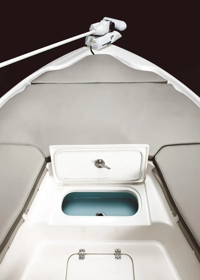 Slide: The Image of 2024 Key West 230 Bay Reef boat interior with storage compartment. - 32
