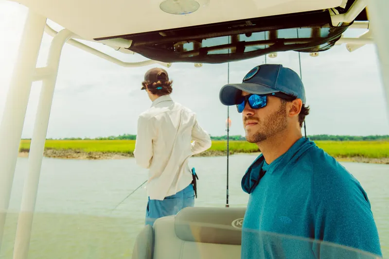 Slide: The Image of Two men fishing on a 2024 Key West 230 Bay Reef boat. - 37