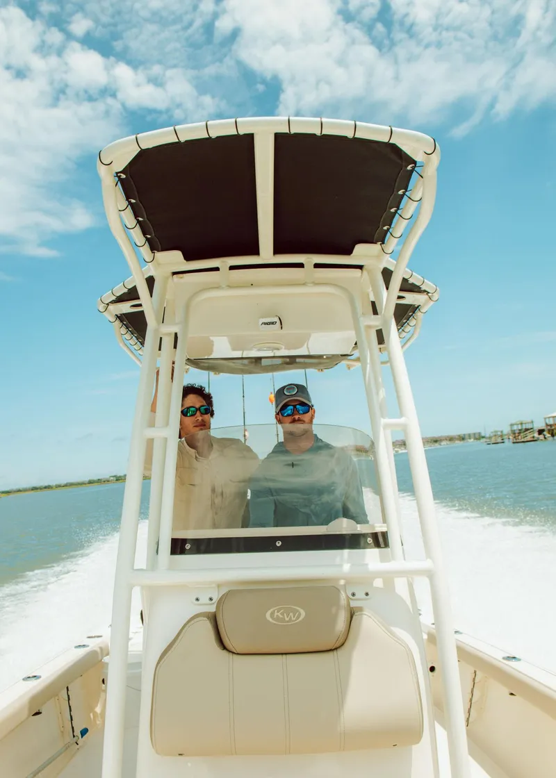 Slide: The Image of 2024 Key West 230 Bay Reef boat on water with two people. - 39