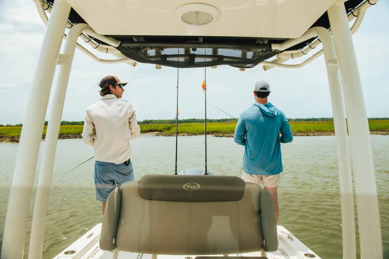 Slide: The Image of Two people fishing on a 2024 Key West 230 Bay Reef boat. - 40